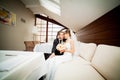 Happy bride and groom on the wedding walk in the modern hotel ha Royalty Free Stock Photo