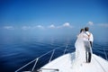 Happy bride and groom on a yacht Royalty Free Stock Photo