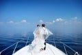 Happy bride and groom on a yacht Royalty Free Stock Photo