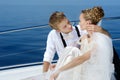 Happy bride and groom on a yacht Royalty Free Stock Photo