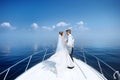 Happy bride and groom on a yacht Royalty Free Stock Photo