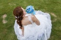 Happy bride holding bouquet of flowers Royalty Free Stock Photo