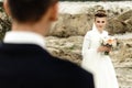 Happy bride looking at her groom at sandy lake, luxury elegant wedding Royalty Free Stock Photo