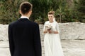 Happy bride looking at her groom at sandy lake, luxury elegant wedding Royalty Free Stock Photo