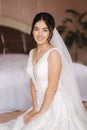 Happy bride sit in wedding dress and smiled. Bridde with bouquet Royalty Free Stock Photo