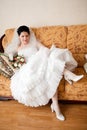 Happy bride on the sofa