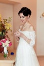 Happy Bride spraying perfume Royalty Free Stock Photo