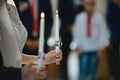 Happy bride and stylish groom holding candles wedding ceremony, wedding couple at matrimony in church, emotional moment, religion Royalty Free Stock Photo