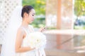 Happy bride talking on cell phone in wedding dress Royalty Free Stock Photo