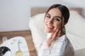 happy bride touching face while smiling Royalty Free Stock Photo