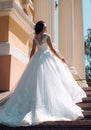 Happy bride before wedding. Beautiful wedding dresses in boutique. Wonderful bridal gown. woman is preparing for wedding