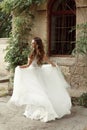 Happy bride woman running in wedding dress at park Royalty Free Stock Photo