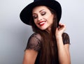 Happy bright makeup lady in fashion hat looking down with red li Royalty Free Stock Photo