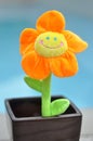 Happy Bright Orange Toy Flower in Plant Pot