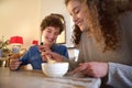 Happy brother and sister eating food