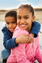 .Portrait of a happy brother and sister smiling.