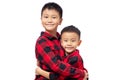 Happy brothers embracing and smiling, wearing red team shirt Royalty Free Stock Photo