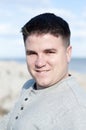 Happy Brown Haired Caucasian Man at the Beach