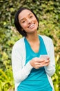Happy brunette using smartphone Royalty Free Stock Photo