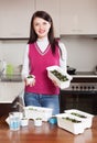Happy brunette woman with sprouts