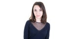 Happy brunette young woman in longsleeve standing looking directly in camera isolated over white wall Feeling confident Royalty Free Stock Photo