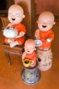 Happy Buddhist novice earthenware.