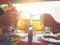 Happy buddy friends drinking beer and clinking glasses at bar and restaurant Royalty Free Stock Photo