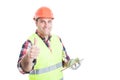 Happy builder holding tablet and showing thumbup