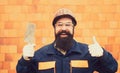 Happy builder worker. Cheerful man with a smile at a construction site. New construction for happy people.