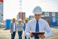 Happy builders and architect at construction site Royalty Free Stock Photo