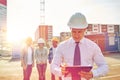 Happy builders and architect at construction site Royalty Free Stock Photo