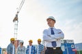 Happy builders and architect at construction site Royalty Free Stock Photo