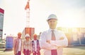 Happy builders and architect at construction site Royalty Free Stock Photo