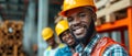 Happy Builders In Hardhats Posing Confidently At Construction Site With Camaraderie