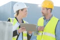 happy builders in hardhats with tablet pc outdoors Royalty Free Stock Photo