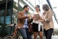 Happy business colleagues talking and walking in the city outdoor Royalty Free Stock Photo