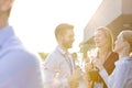 Happy business colleagues talking during success party on rooftop Royalty Free Stock Photo