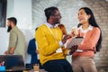 Business colleagues using digital tablet while standing in a lobby Royalty Free Stock Photo