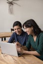 Happy business colleagues women talking on video call together Royalty Free Stock Photo