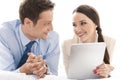 Happy business couple with digital tablet looking at each other in hotel Royalty Free Stock Photo