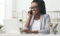 Happy Business Girl Having Phone Conversation Using Laptop In Office Royalty Free Stock Photo