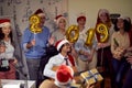 Happy business group people in Santa hat at Xmas party Royalty Free Stock Photo