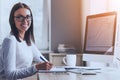 Happy Business Lady Using Computer in Office. Royalty Free Stock Photo