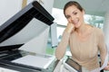 happy business lady using copier machine