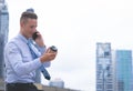 Happy Business man making call on his mobile phone and drink coffee Royalty Free Stock Photo