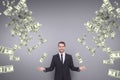 Happy business man with money rain against purple background Royalty Free Stock Photo