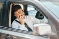 Happy business man, phone call and driving car for communication, mobile networking and chat in traffic. Indian male Royalty Free Stock Photo