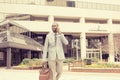 Happy business man talking on his phone while walking outside Royalty Free Stock Photo