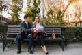 Happy Business Man and Woman Chatting on Bench Royalty Free Stock Photo