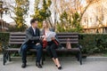Happy Business Man and Woman Chatting on Bench. Royalty Free Stock Photo